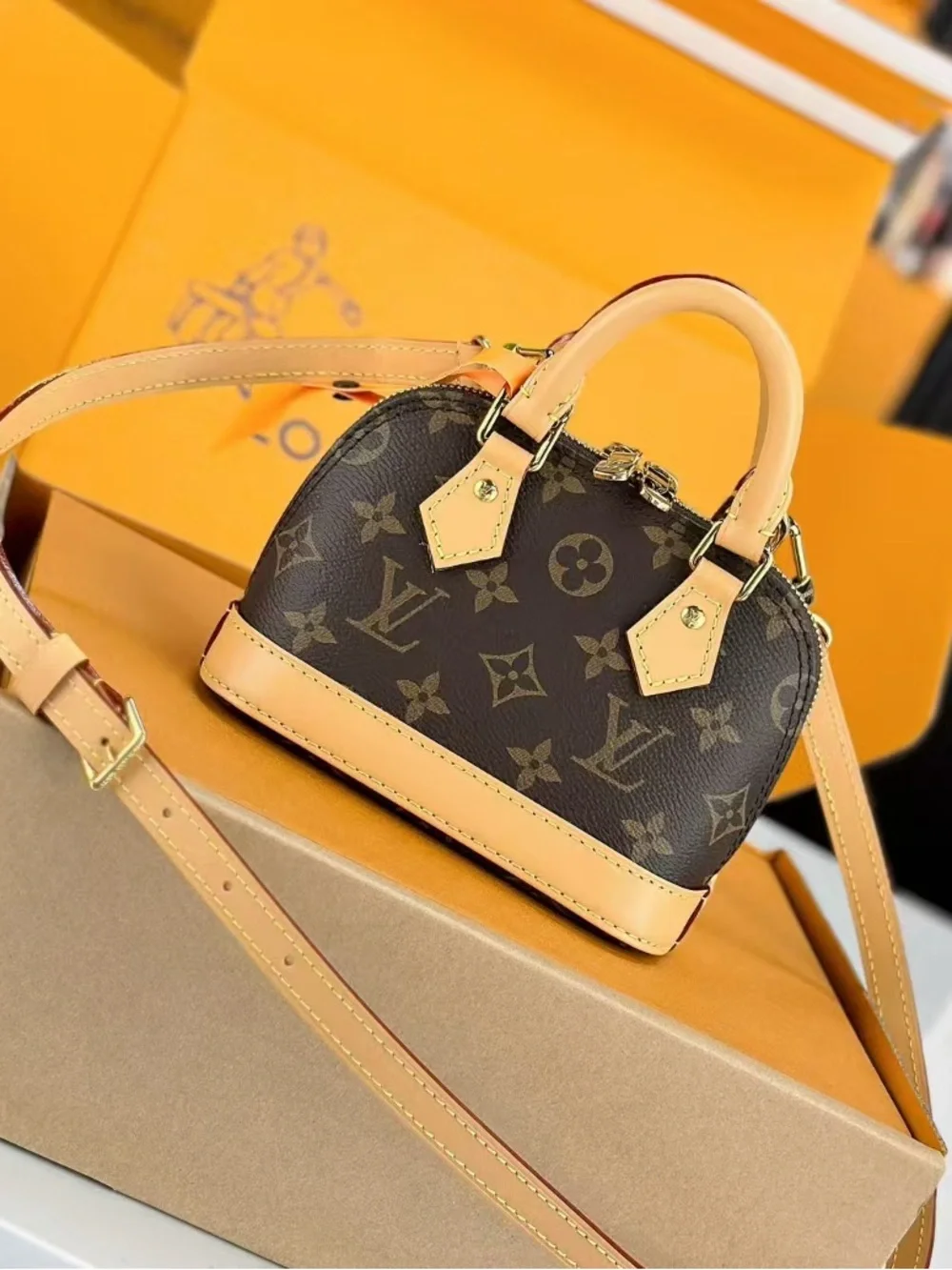 Louis Vuttion Brown Monogram Mini Handbag with Tan Trim